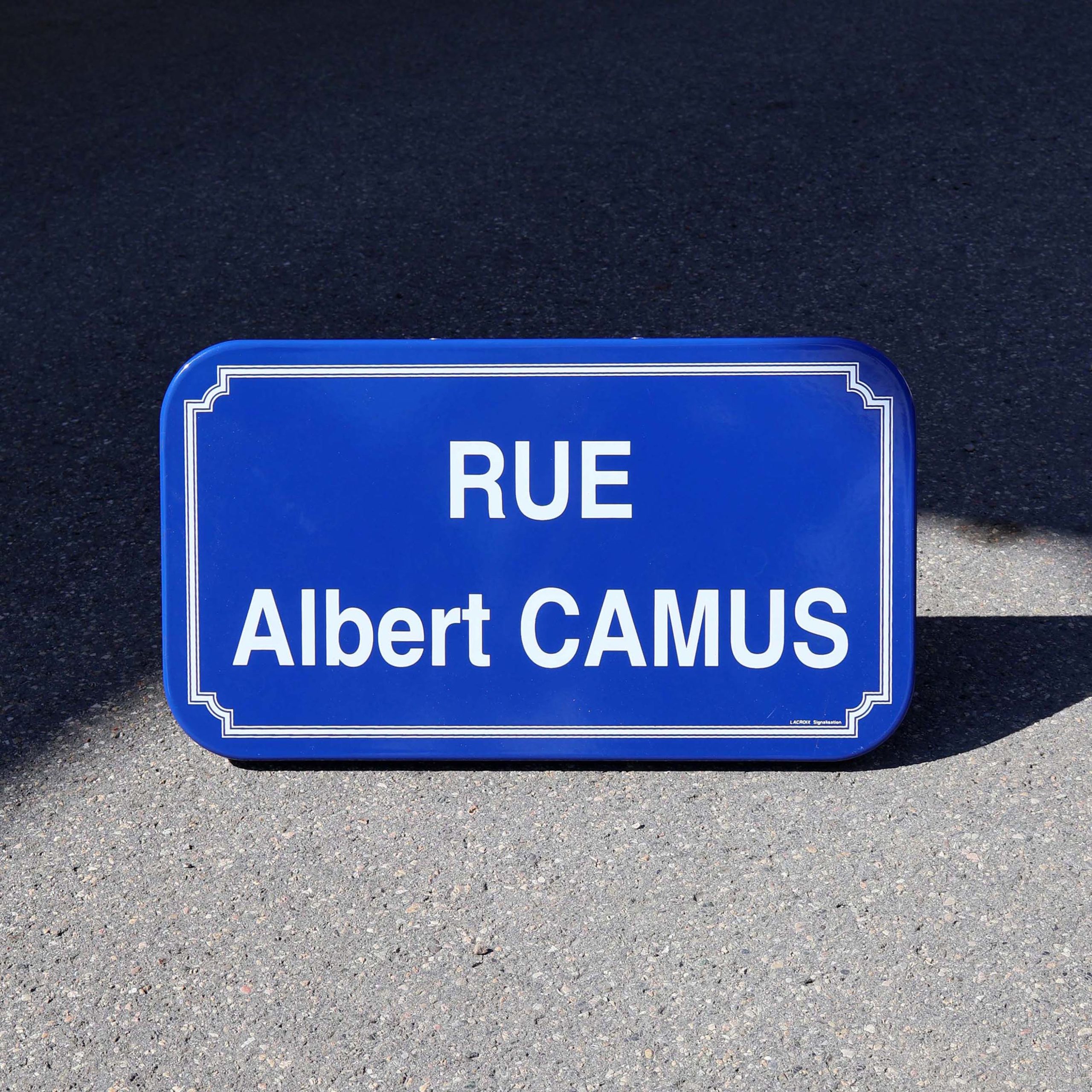 Plaque de rue Albert Camus French street sign cobalt blue porcelain enamel. Plaque de rue pour honorer le romancier Français.
